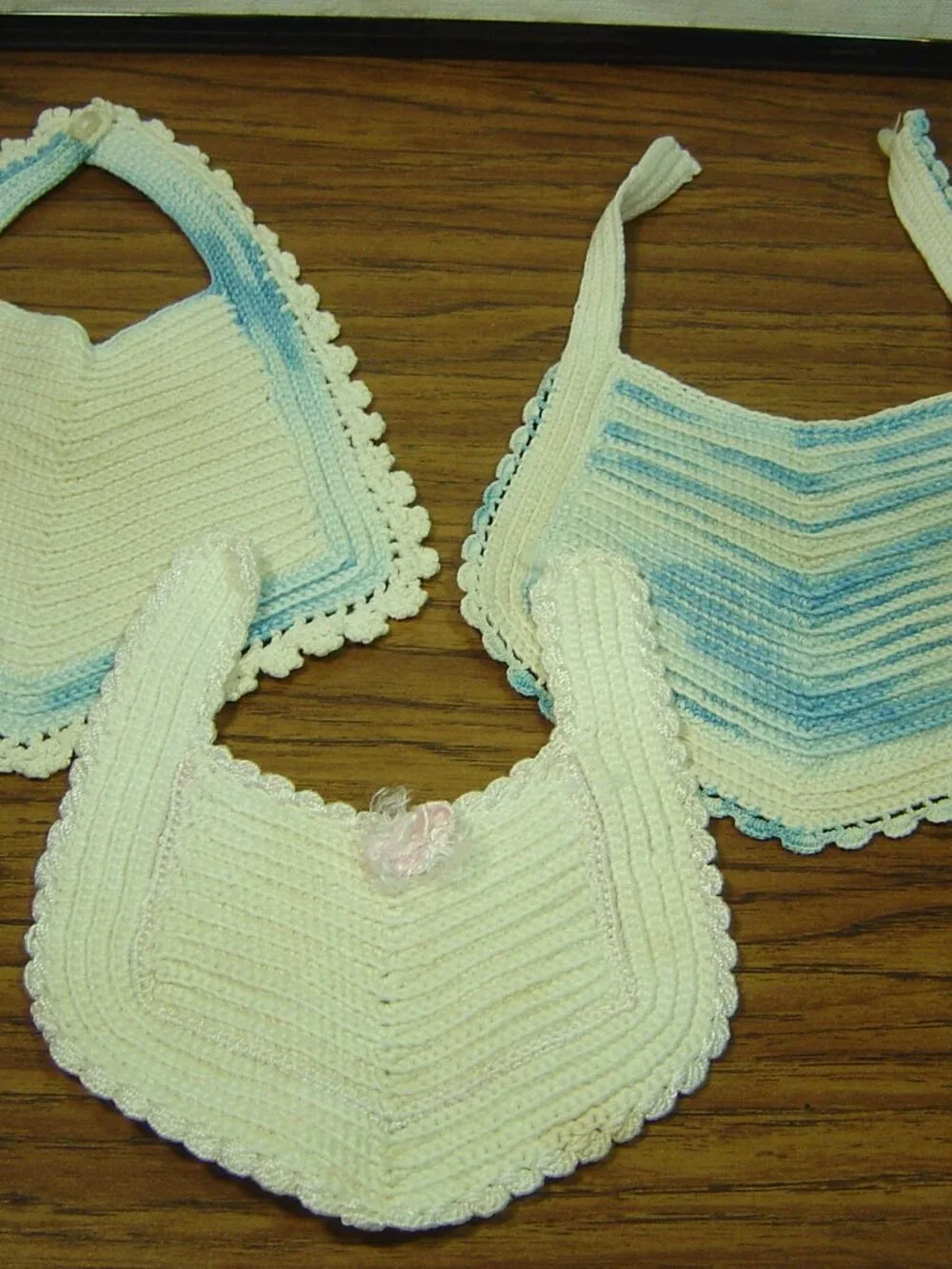 Lot of 5 vintage baby items-3 crocheted bibs, 1 pair of booties & 1 pink slip